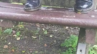 Girl Pissing outside on bench