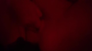 Playing with my naked body under the red lights 