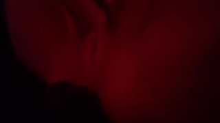 Playing with my naked body under the red lights 