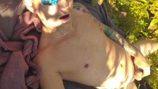 Fun by the water in public park with buttplug