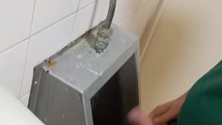 Big cock piss at urinal