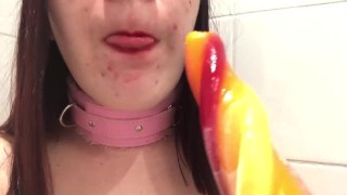 Teen sucks on ice pop 