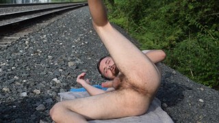 Stroking and Posing Next to Railroad Tracks