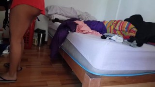 I film my sexy friend while tidying up her room.