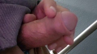 Playing with my uncut cock in the bathroom.