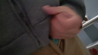 Playing with my uncut cock in the bathroom.