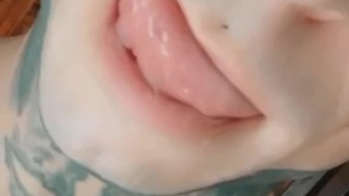 Horny tattooed guy licking his lips