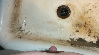 Just a small piss In a dirty sink.