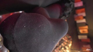 Legs in black opaque pantyhose