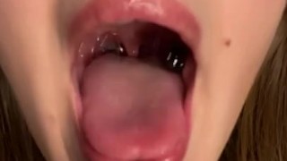 Swallowing gummy bears with open mouth