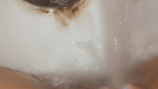 Milf uses water faucet to make herself cum