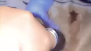 Kitten playing with the cat with her tail in 