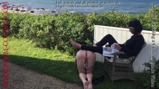 Miss M. relaxing outdoors with her naked slave