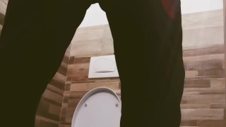 A guy with a big cock locked the toilet and masturbated. Long slow cumshot. 