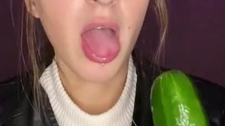 Cucumber sucking. Leather jacket 