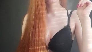 redhead girl sexually smokes a cigarette