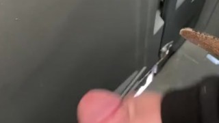 Stroking in a construction porta potty. 