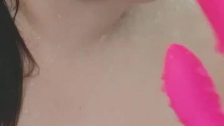 Chubby busty girl teases in the shower with vibrator