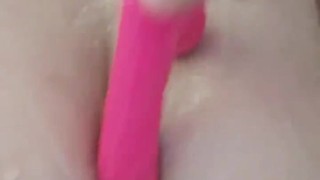 Chubby busty girl teases in the shower with vibrator
