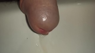 Pissing cock, extreme close up