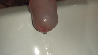 Pissing cock, extreme close up