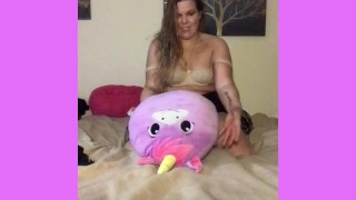 Pillow humping in fetish clothing