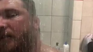 Stud in the shower playing with cock