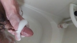 Horny otter guy jerks off in the shower and shoots a load