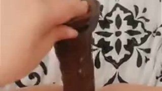Horny little slut fucks pussy with BBC Dildo