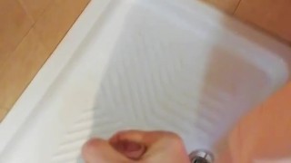 Redheaded cock beating in the shower