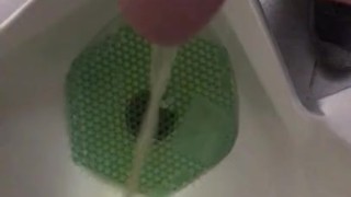Peeing at a public urinal, was about to Jerk off but another guy walked in, I had to stop recording.