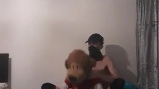 Very skinny teen with a mask and long socks fucks his beloved teddy bear on his bed