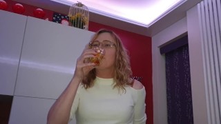 Lisa pissing in a glass then having a taste