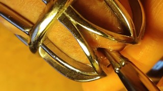 Urethral sounding for locked in chastity cage cock. Close up.