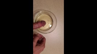 Piss and cum into a bowl. Using piss as lube.