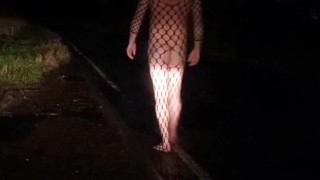 Fishnet bodysuit outside with passing car