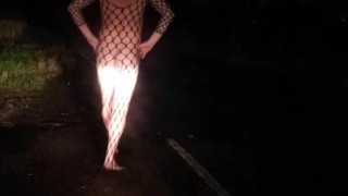 Fishnet bodysuit outside with passing car