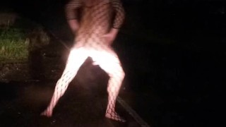 Fishnet bodysuit outside with passing car