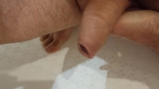 Pissing on my palm and masturbating my dick in the bathroom.