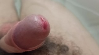 Extreme closeup uncut pissing cock