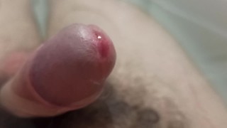 Extreme closeup uncut pissing cock