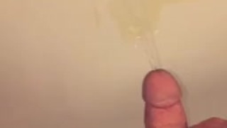 Peeing while having a hard cock 