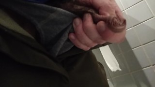 Uncut dick pissing in public toilet