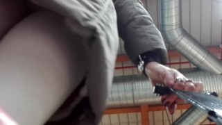 Sissy in white pantyhose and chastity cage underskirt and pissing at market