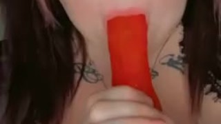 Egirl sucks on big pink dildo