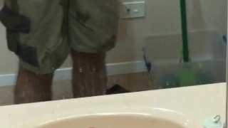 Tradie in hiviz shows his cock in the mirror