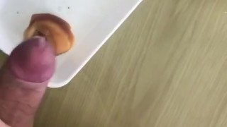 Adding the sauce to her snack