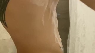 I caress my body with foam in the shower
