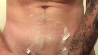 Hot tattooed guy shaves cock balls and ass 