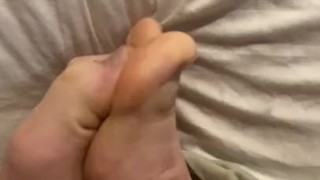 Playing with my sweaty feet after a long day.